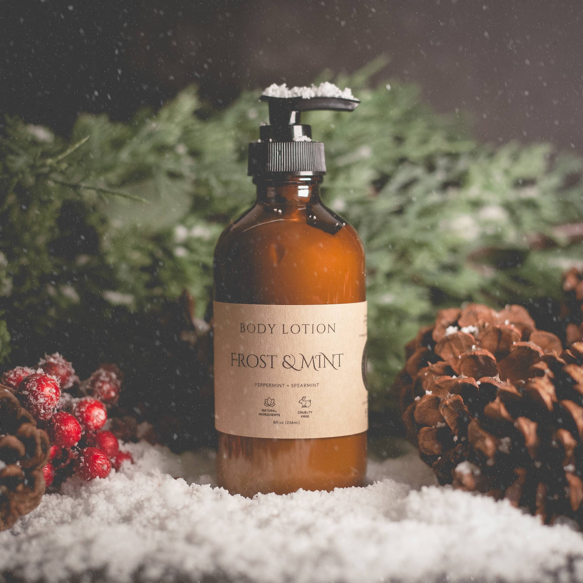 Body lotion bottle labeled 'Frost & Mint' with a snowy background