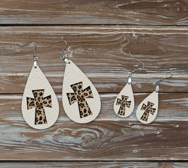 WHITE ANIMAL PRINT CROSS EARRINGS